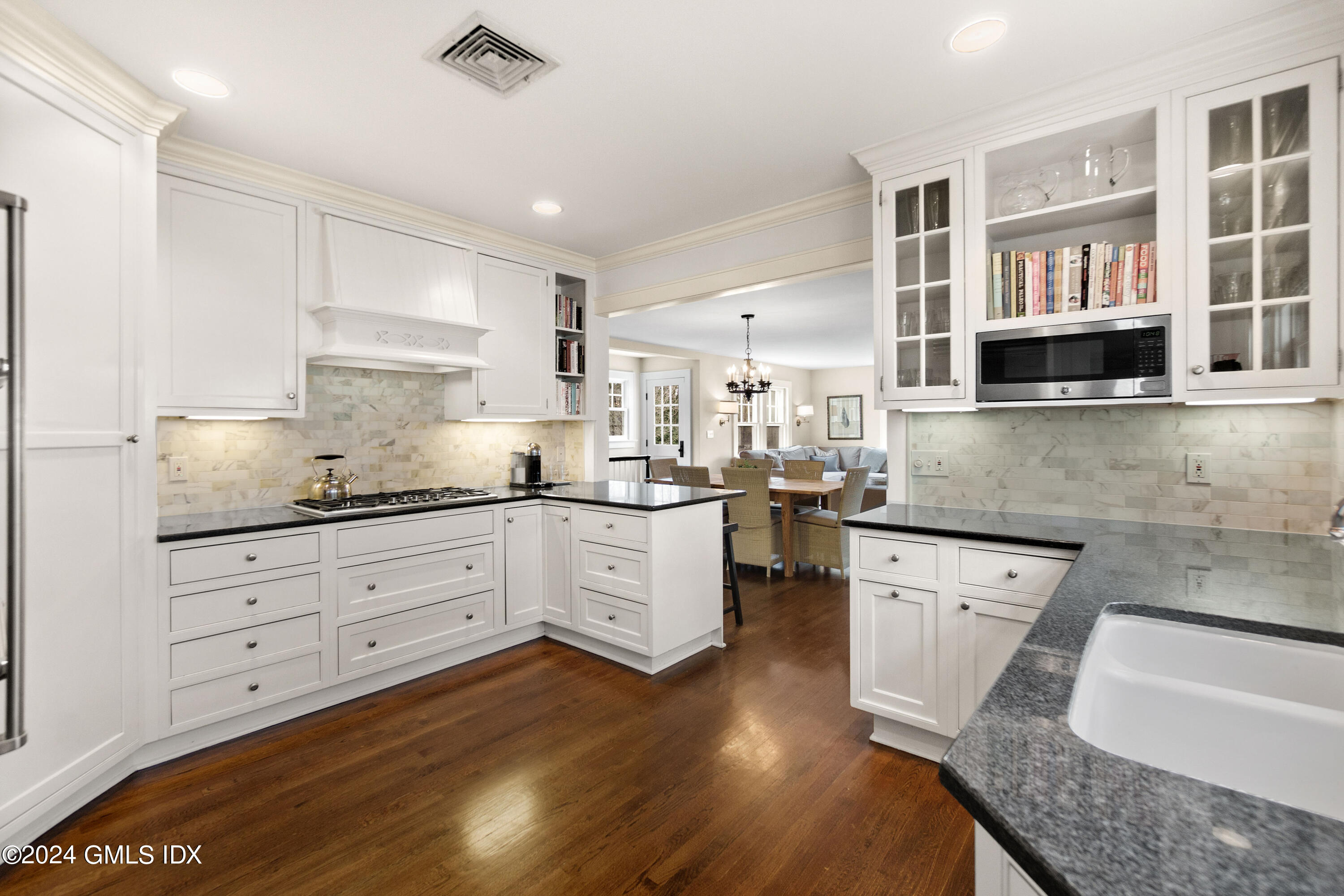 20 Knoll Street Riverside, CT 06878 - Photo 9 of 27 a kitchen with granite countertop white cabinets and white appliances