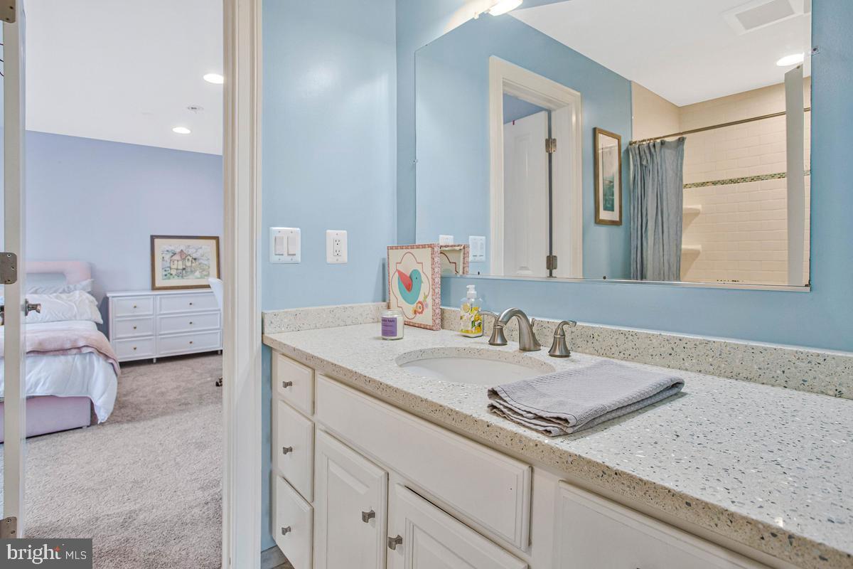 5 Jessie Road Harwood, MD 20776 - Photo 50 of 87 a bathroom with a granite countertop sink and a mirror