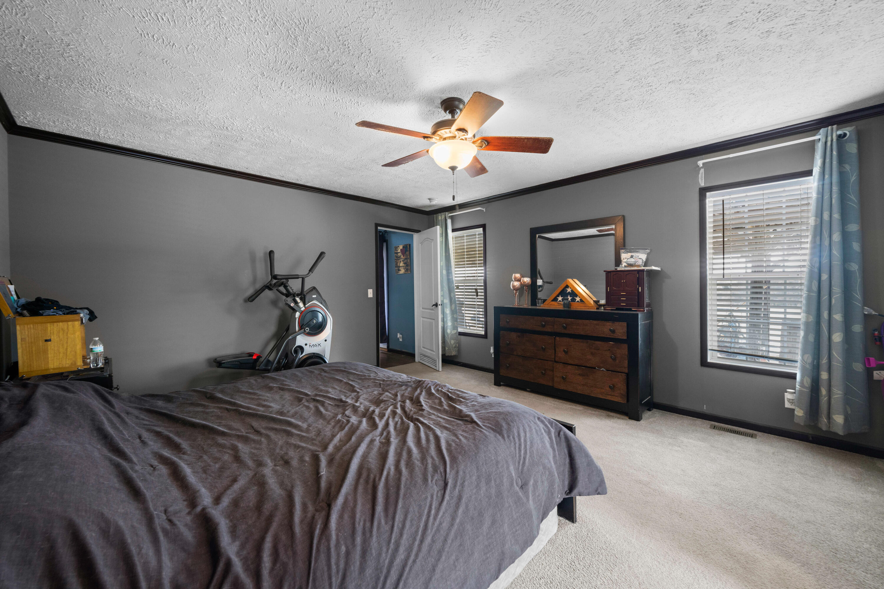8320 Thames Road Baker, FL 32531 - Photo 31 of 48 a bedroom with a bed and a ceiling fan