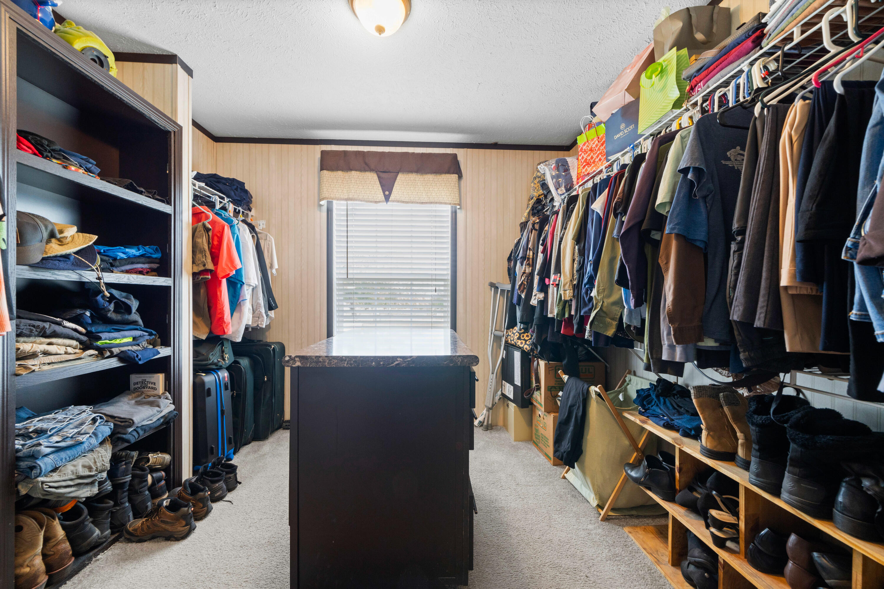 8320 Thames Road Baker, FL 32531 - Photo 33 of 48 a view of walk in closet with clothes and shoes