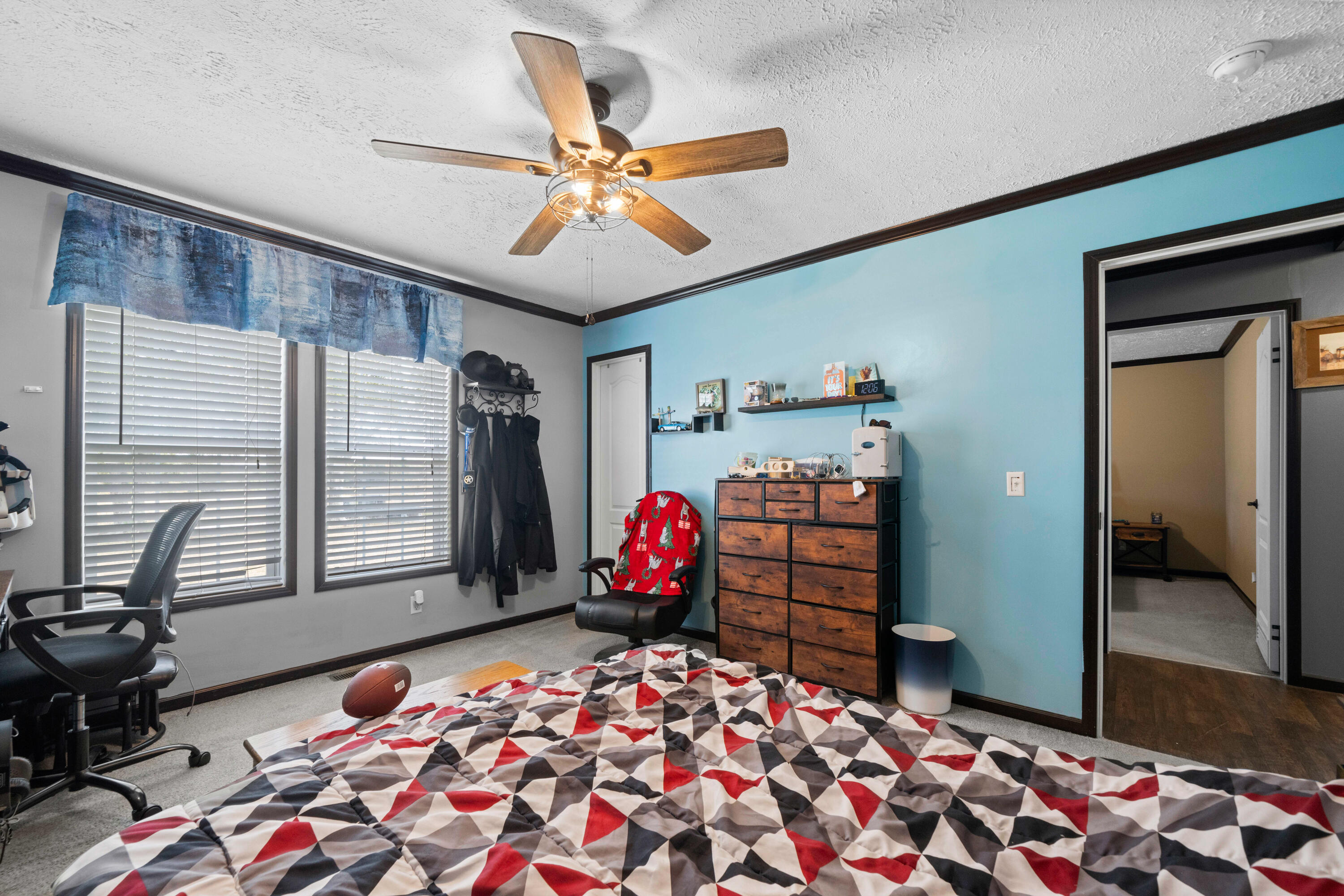 8320 Thames Road Baker, FL 32531 - Photo 37 of 48 a bedroom with a bed and wooden floor