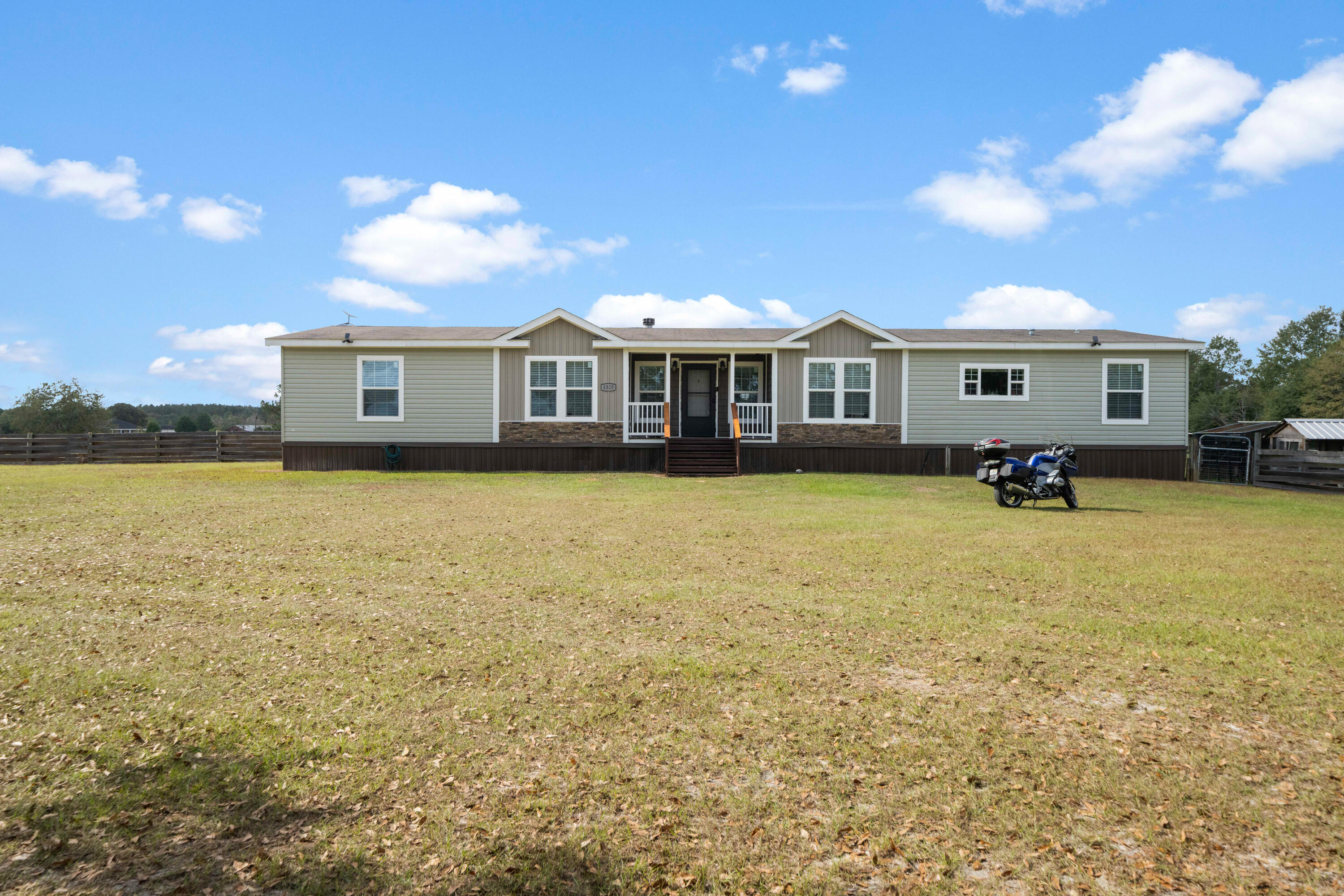 8320 Thames Road Baker, FL 32531 - Photo 48 of 48 a view of a house with swimming pool and sitting area