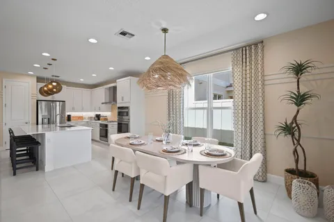 a view of a dining room and a table chairs
