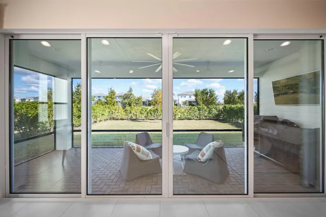 an aerial view of a house with a swimming pool yard and outdoor seating