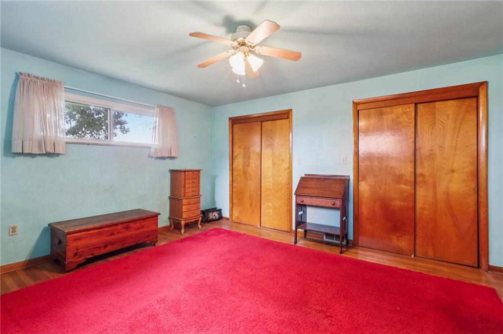 957 Cherry Lane Road Apollo, PA 15613 - Photo 14 of 38 a bedroom with furniture and a chandelier