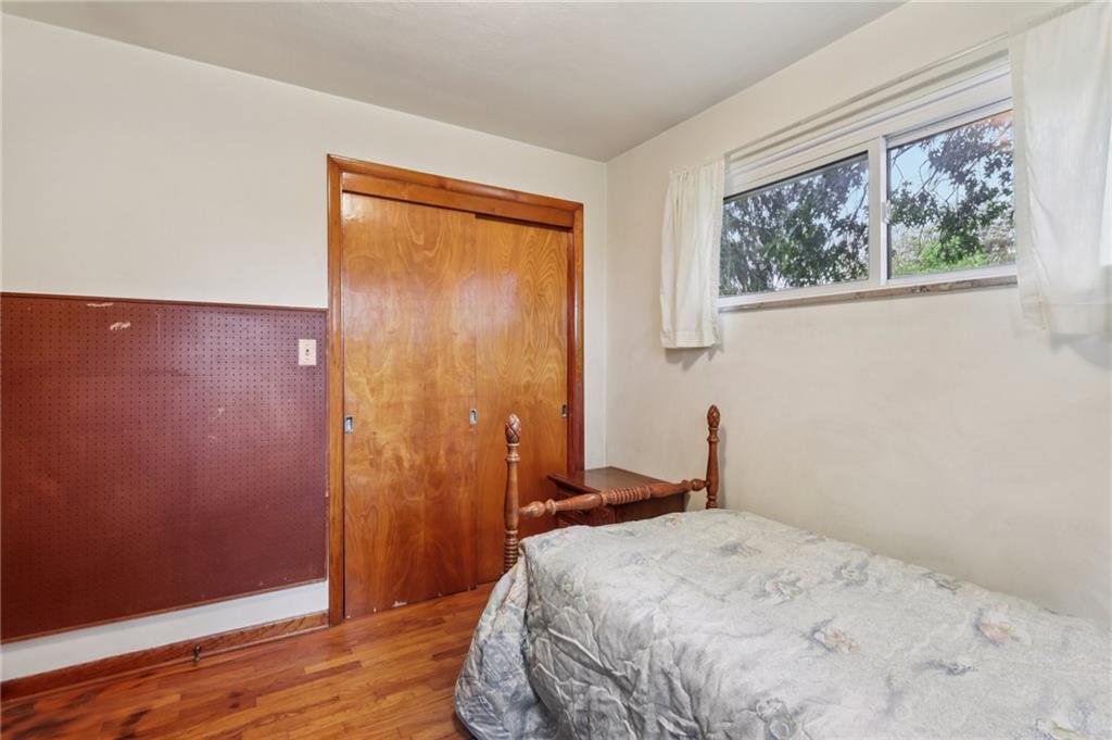 957 Cherry Lane Road Apollo, PA 15613 - Photo 17 of 38 a bedroom with a bed and wooden floor