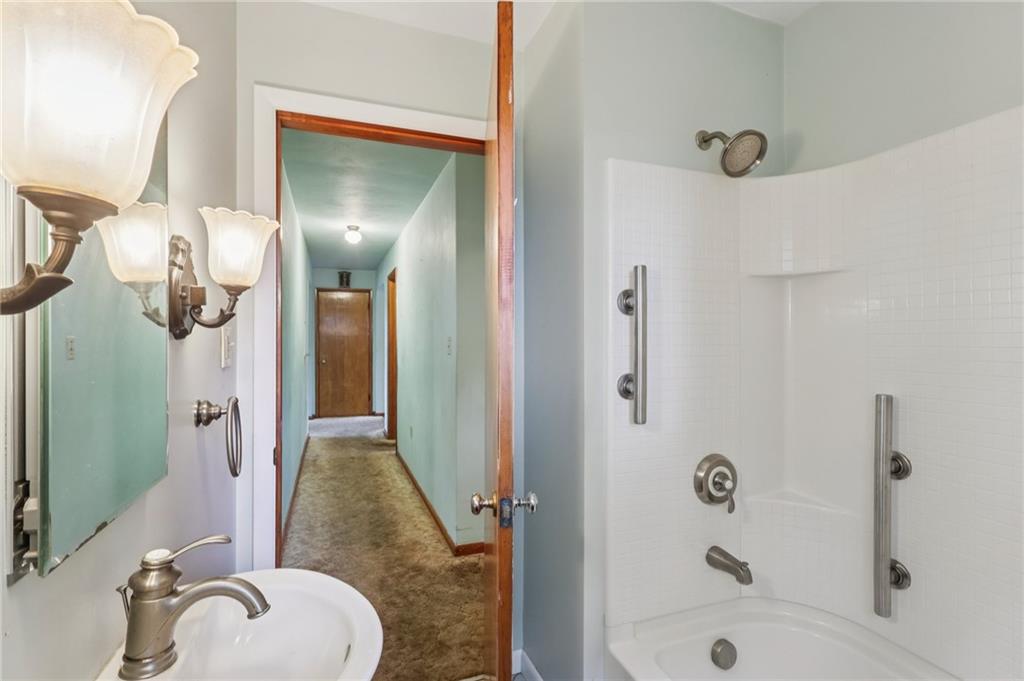 957 Cherry Lane Road Apollo, PA 15613 - Photo 20 of 38 a bathroom with a granite countertop sink mirror and shower