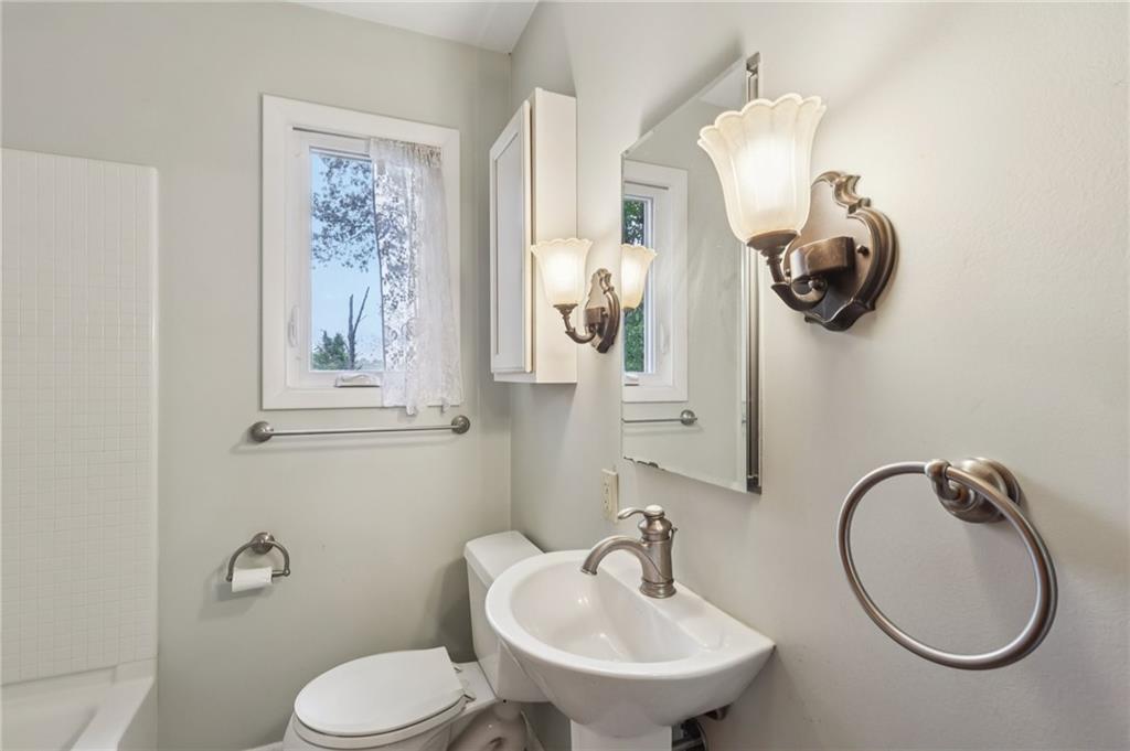 957 Cherry Lane Road Apollo, PA 15613 - Photo 21 of 38 a bathroom with a toilet sink and mirror