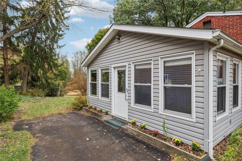 957 Cherry Lane Road Apollo, PA 15613 - Photo 31 of 38 a small white building with a large window and large tree