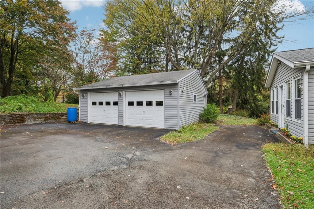 957 Cherry Lane Road Apollo, PA 15613 - Photo 32 of 38 a view of a house with a yard and garage
