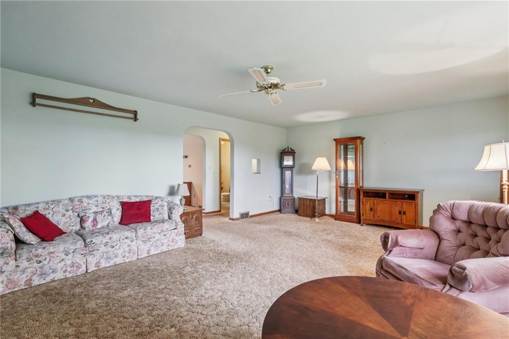 957 Cherry Lane Road Apollo, PA 15613 - Photo 8 of 38 a bedroom with furniture and a chandelier