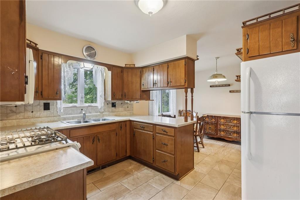 957 Cherry Lane Road Apollo, PA 15613 - Photo 9 of 38 a kitchen with a sink appliances and cabinets