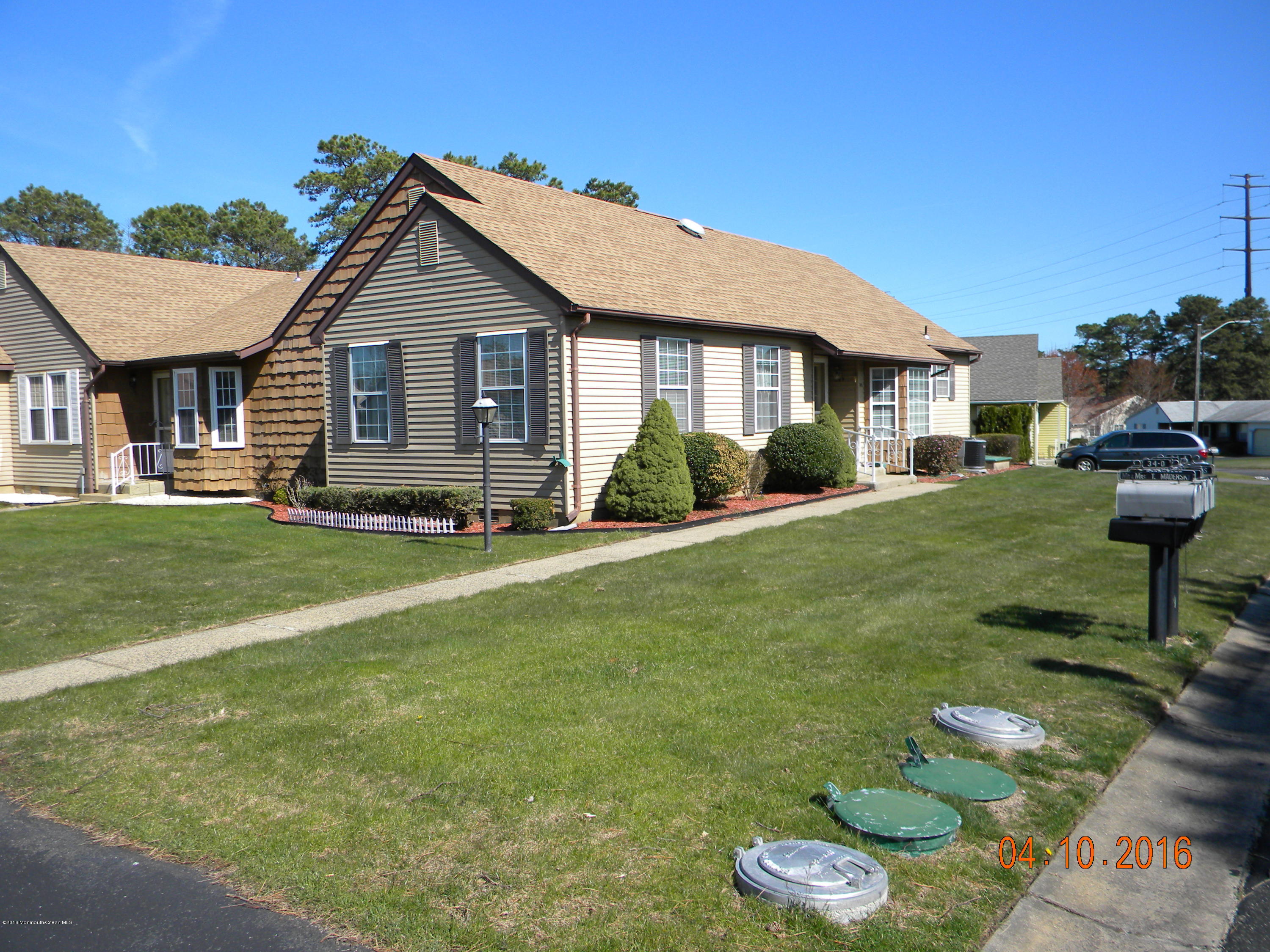 34A Ashley Road, Unit D Whiting, NJ 08759 - Photo 1 of 35 a front view of a house with a yard