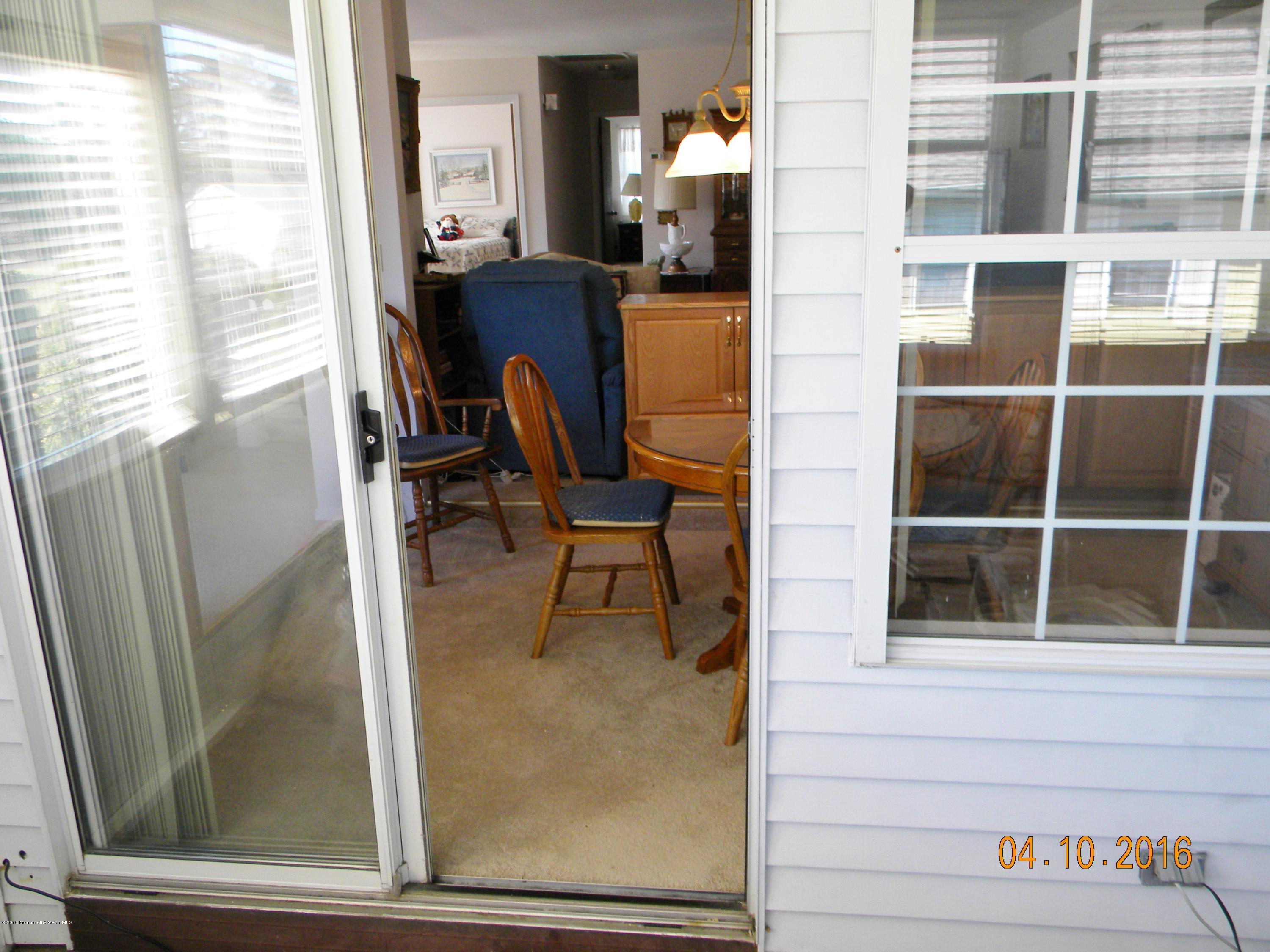 34A Ashley Road, Unit D Whiting, NJ 08759 - Photo 11 of 35 a view of a balcony with chair and front door