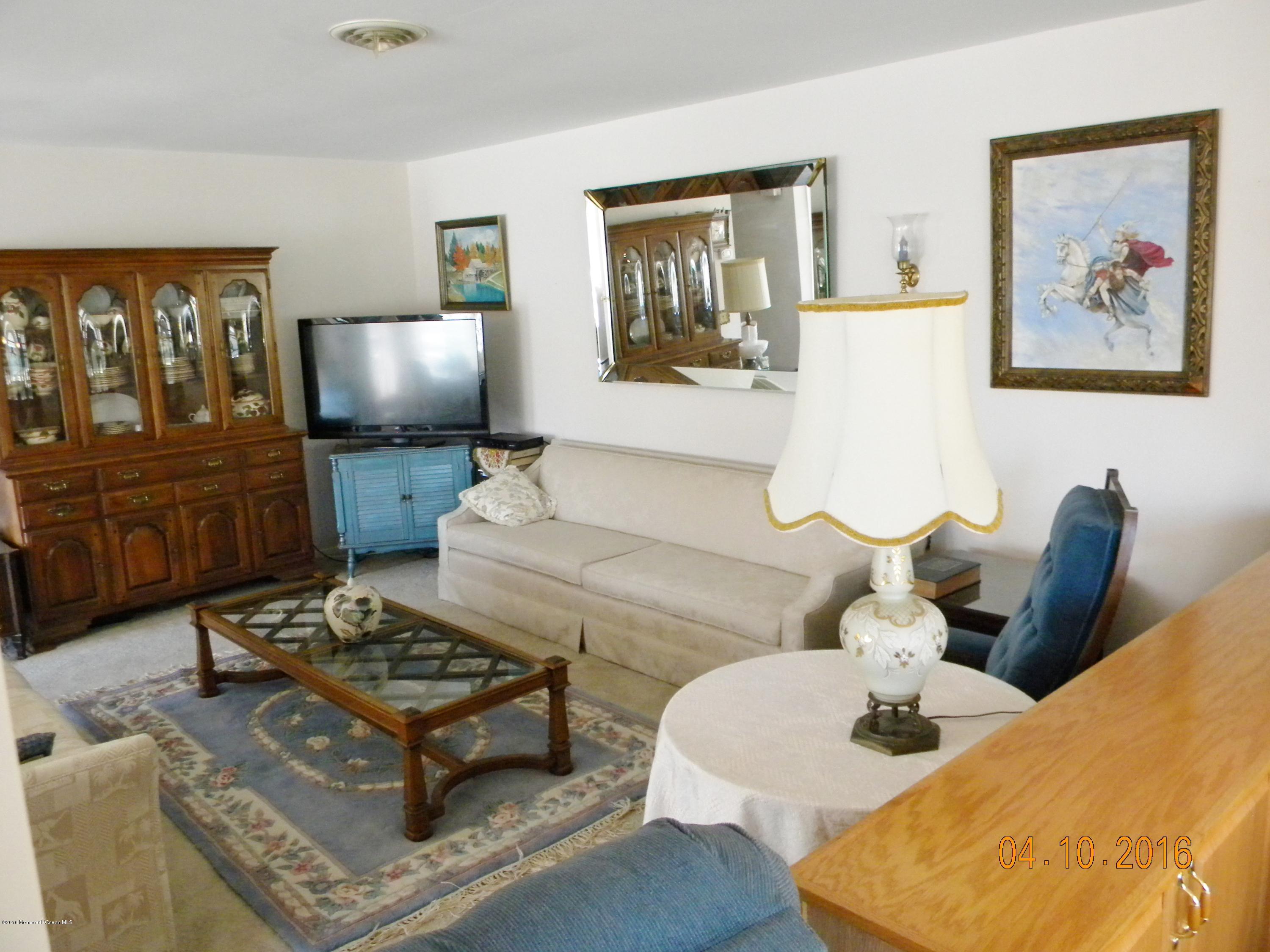 34A Ashley Road, Unit D Whiting, NJ 08759 - Photo 19 of 35 a living room with furniture and a flat screen tv