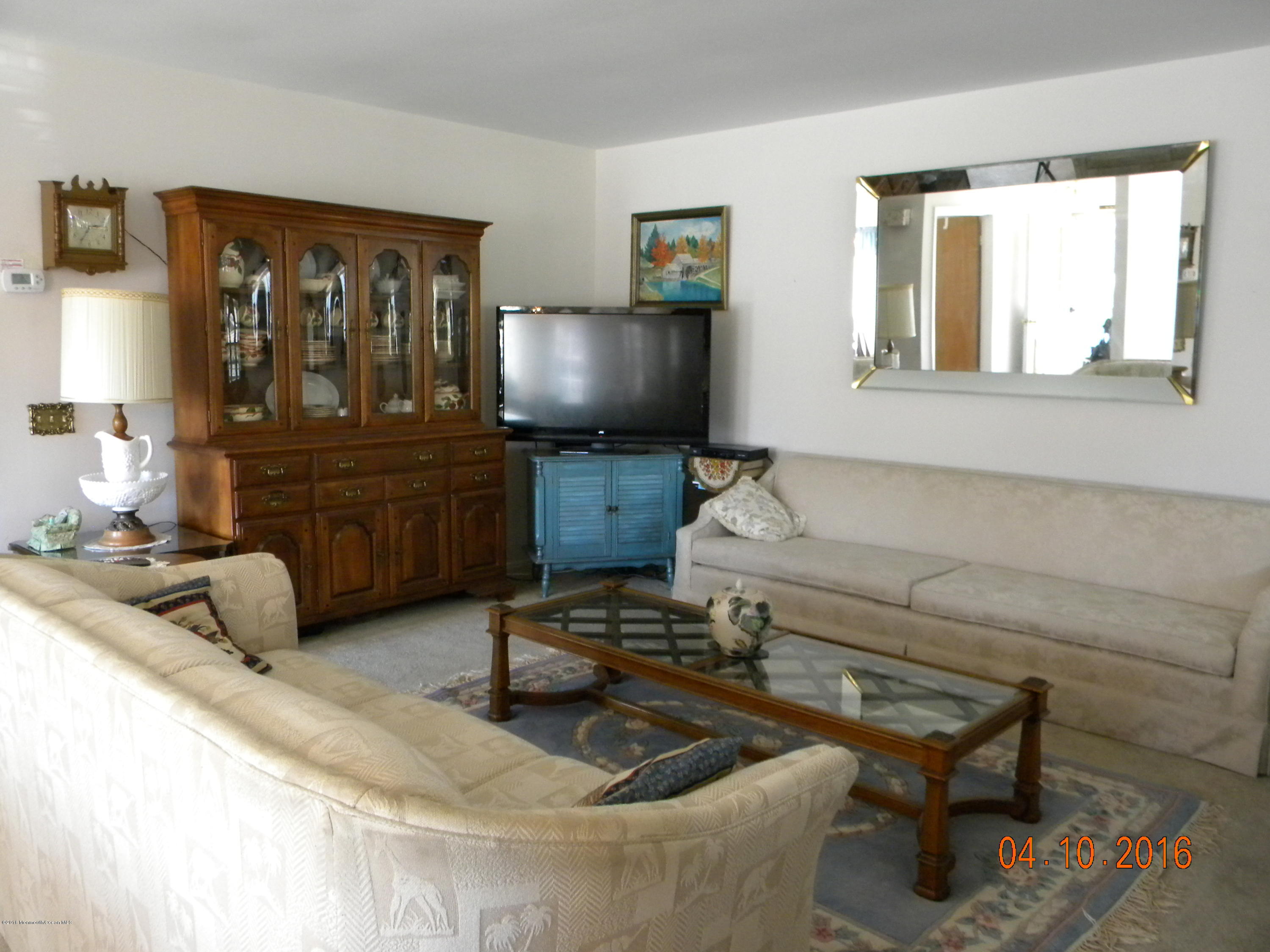 34A Ashley Road, Unit D Whiting, NJ 08759 - Photo 20 of 35 a living room with furniture and a flat screen tv