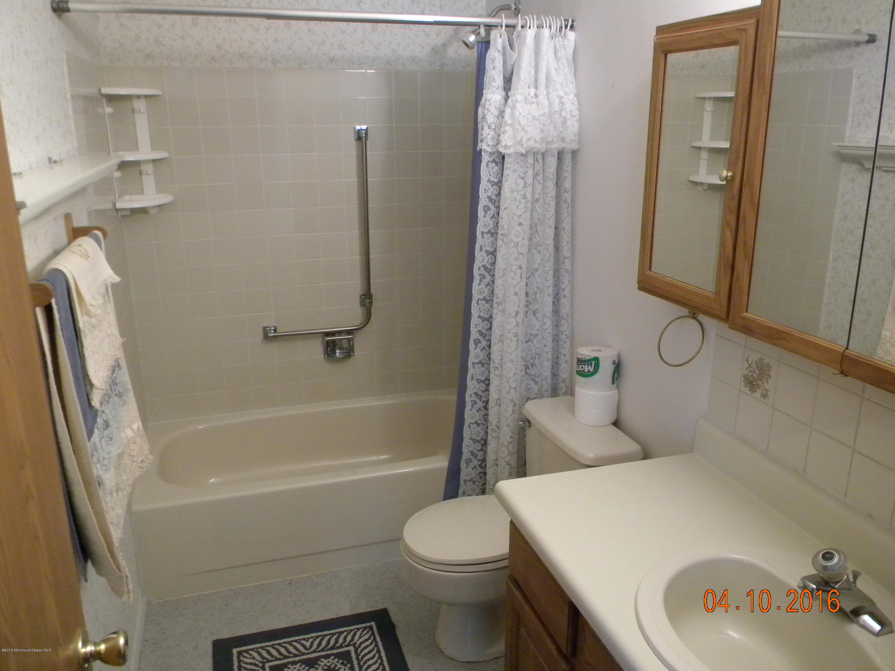 34A Ashley Road, Unit D Whiting, NJ 08759 - Photo 29 of 35 a bathroom with a sink toilet and shower