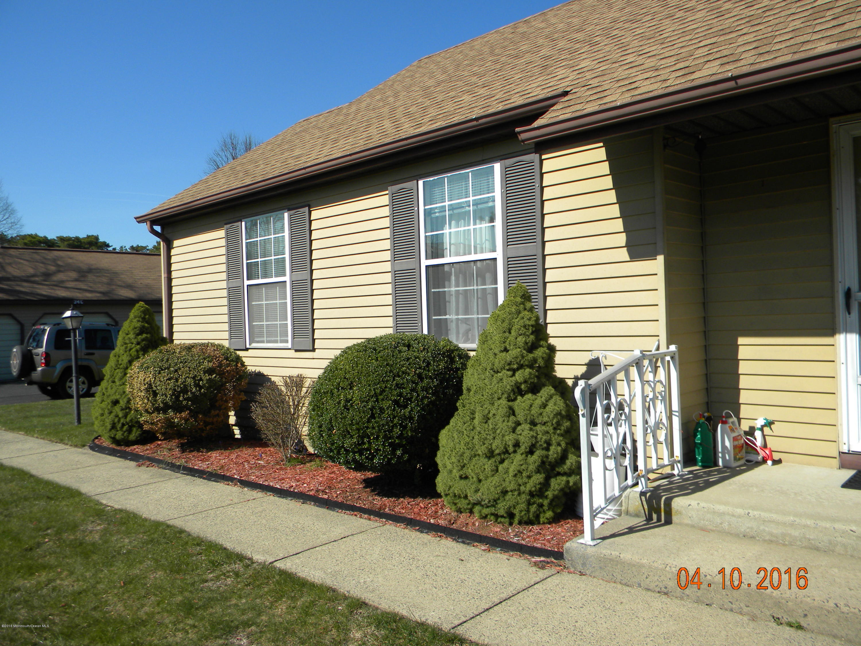 34A Ashley Road, Unit D Whiting, NJ 08759 - Photo 33 of 35 a view of a house with a garden