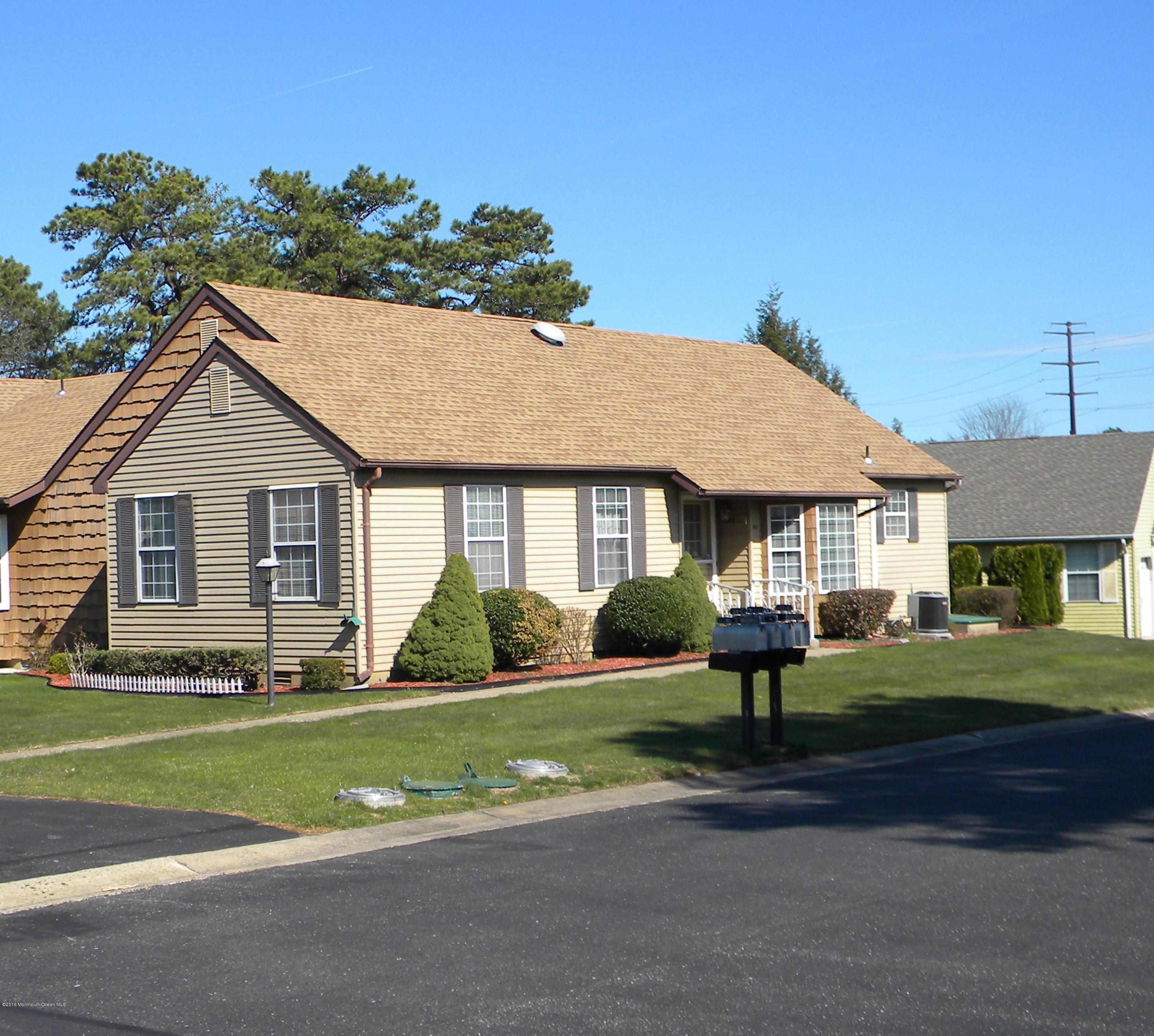 34A Ashley Road, Unit D Whiting, NJ 08759 - Photo 34 of 35 a front view of a house with a yard