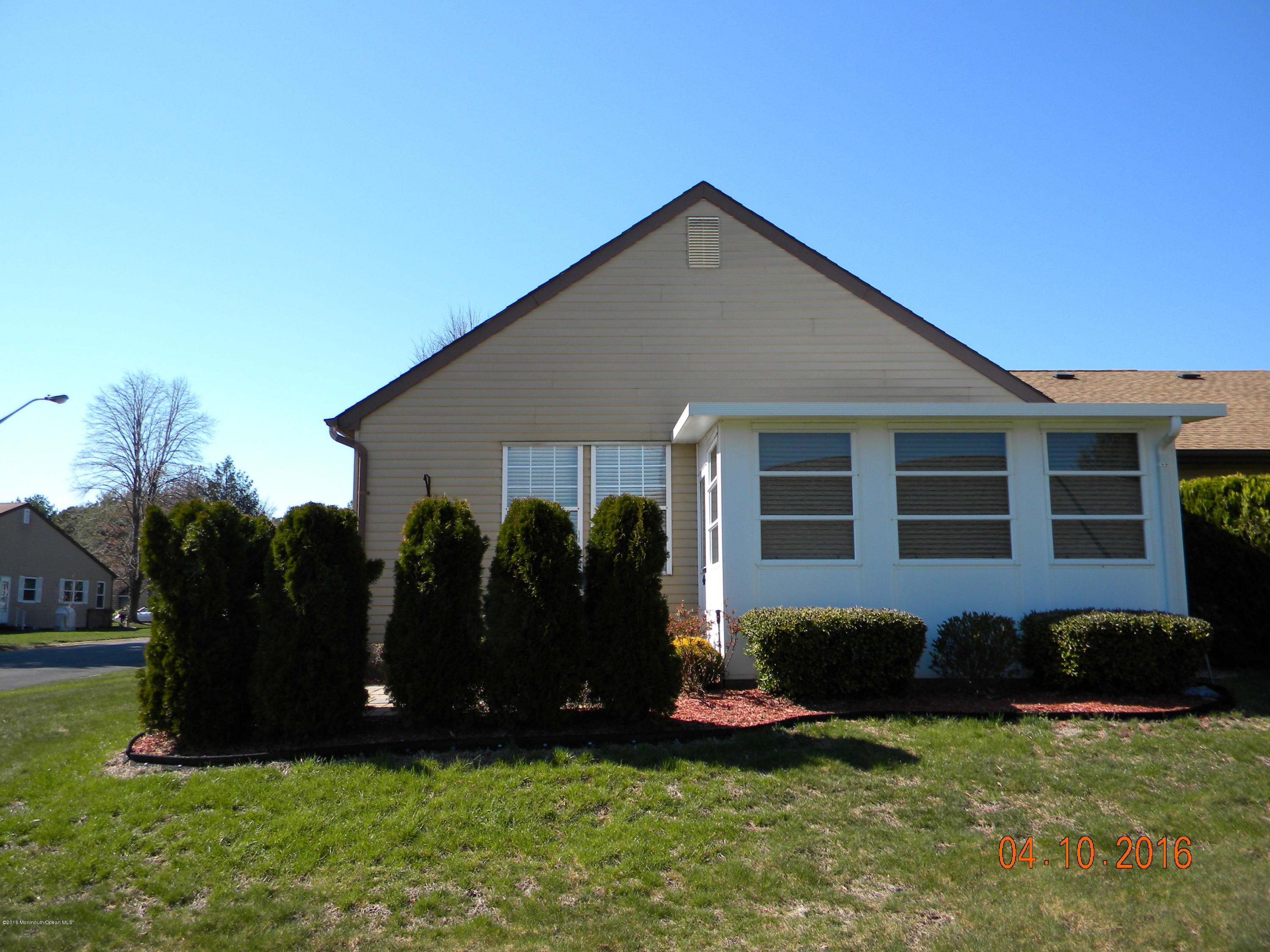 34A Ashley Road, Unit D Whiting, NJ 08759 - Photo 7 of 35 a front view of house with yard and outdoor seating