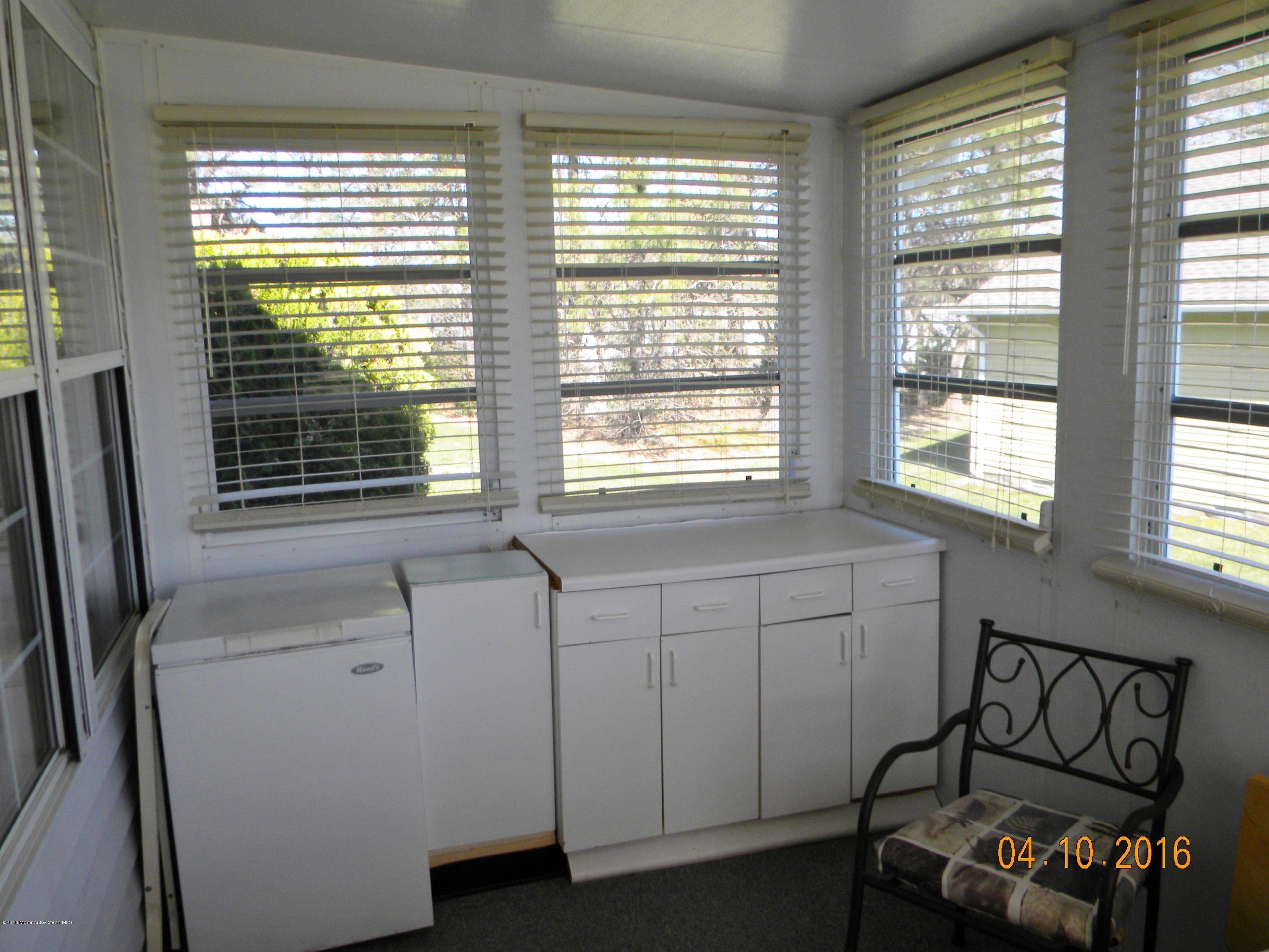 34A Ashley Road, Unit D Whiting, NJ 08759 - Photo 10 of 35 a bedroom with a bed and a window