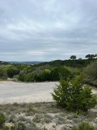 a view of a lake with a yard