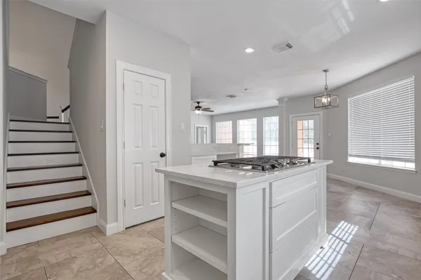a kitchen that has a stove and a sink