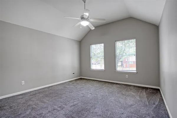 a view of room with window and ceiling fan