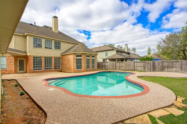 a view of a house with swimming pool
