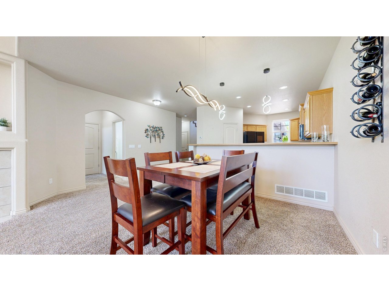 4672 West 20th Road, Unit 413 Greeley, CO 80634 - Photo 15 of 37 a dining room with a table and chairs