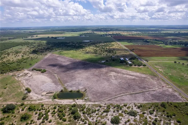 a view of a lake with a yard