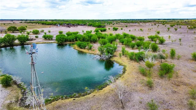 a view of a lake with a yard