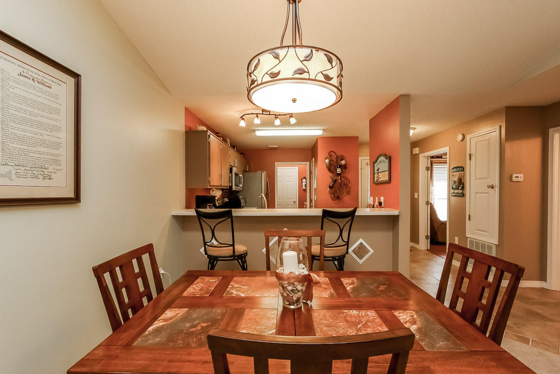 204 Vía Largo Santa Rosa Beach, FL 32459 - Photo 13 of 29 a view of a dining room with furniture and a chandelier
