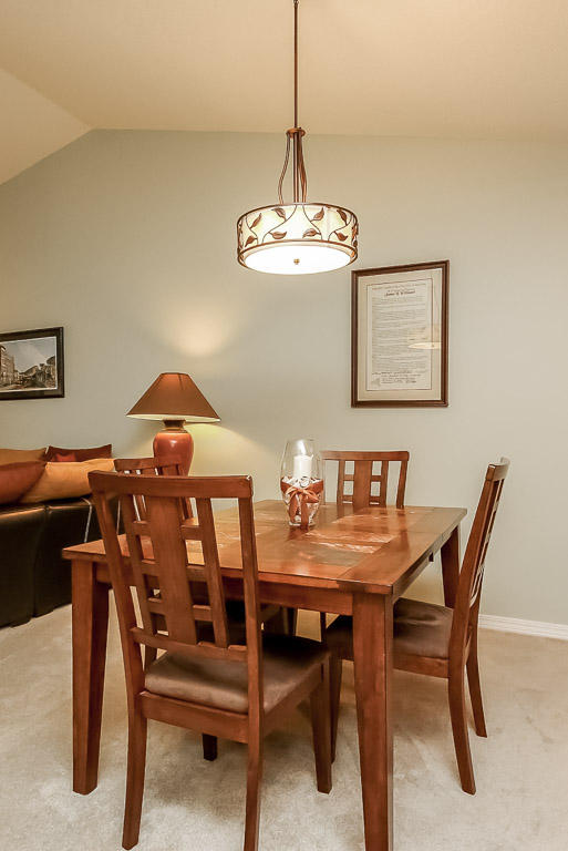 204 Vía Largo Santa Rosa Beach, FL 32459 - Photo 14 of 29 a view of a dining room with furniture and chandelier