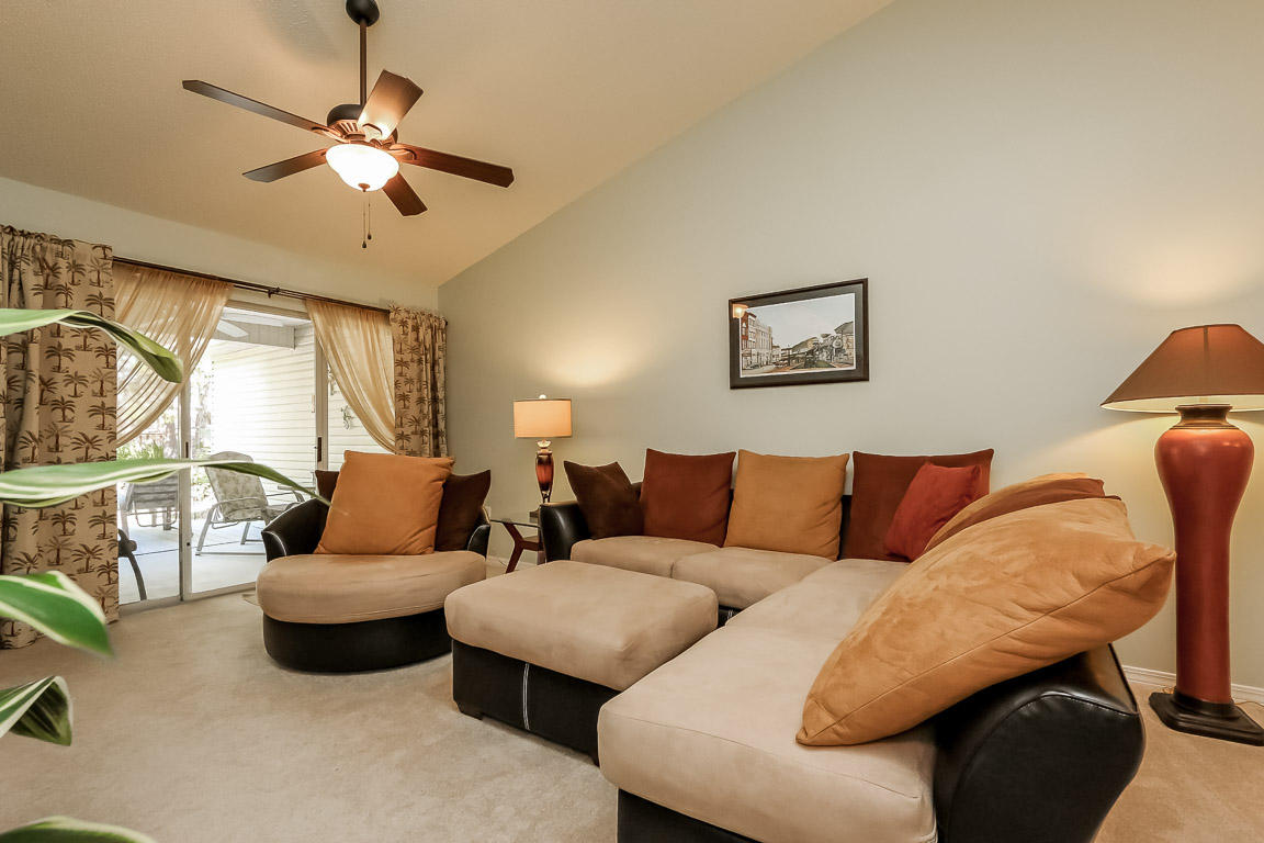 204 Vía Largo Santa Rosa Beach, FL 32459 - Photo 15 of 29 a living room with furniture ceiling fan and a window