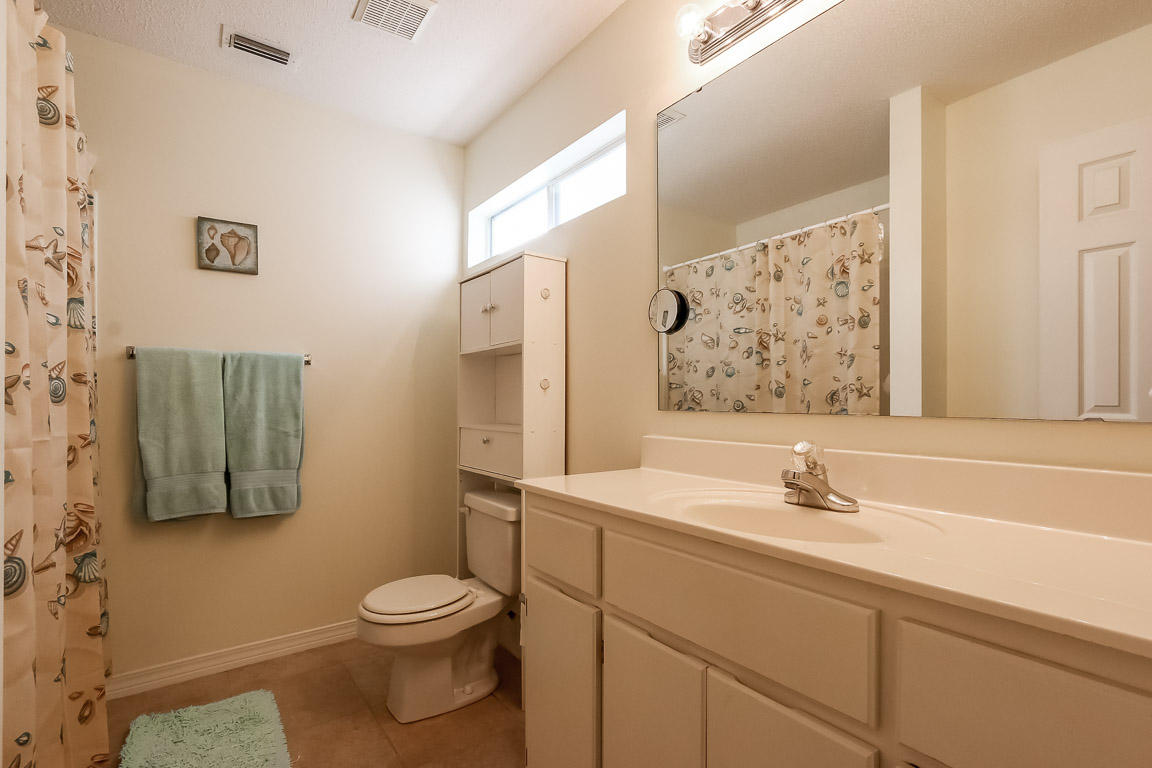 204 Vía Largo Santa Rosa Beach, FL 32459 - Photo 20 of 29 a bathroom with a sink toilet and shower
