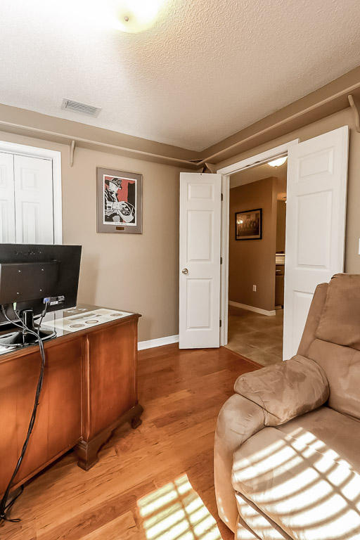 204 Vía Largo Santa Rosa Beach, FL 32459 - Photo 22 of 29 a bedroom with a bed and furniture