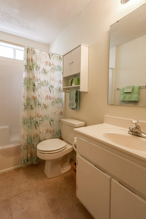 204 Vía Largo Santa Rosa Beach, FL 32459 - Photo 25 of 29 a bathroom with a sink a toilet and shower