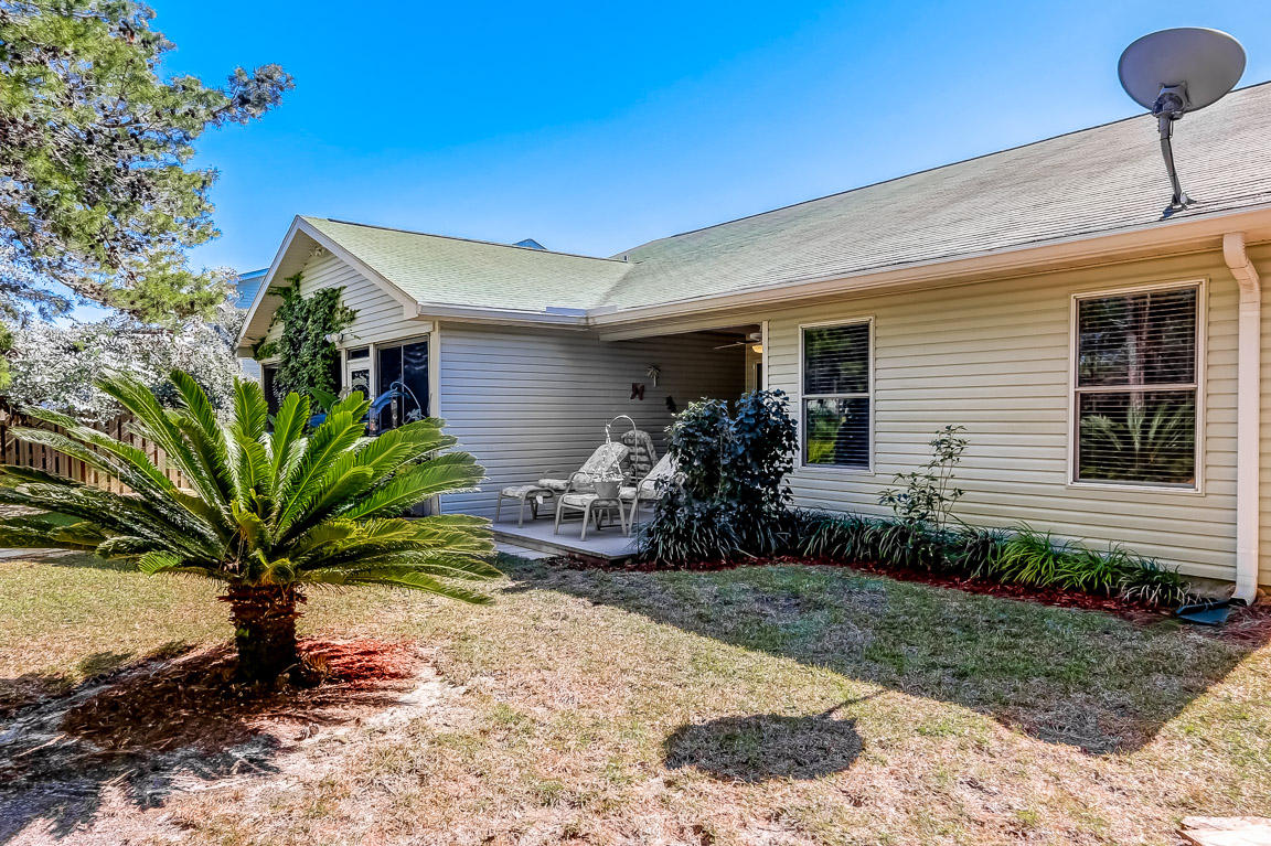 204 Vía Largo Santa Rosa Beach, FL 32459 - Photo 26 of 29 a front view of house with yard and seating space