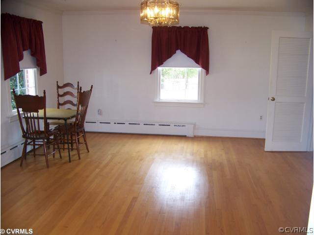 565 Broad St Road Manakin-Sabot, VA 23103 - Photo 3 of 8 a view of a room with wooden floor table and chairs