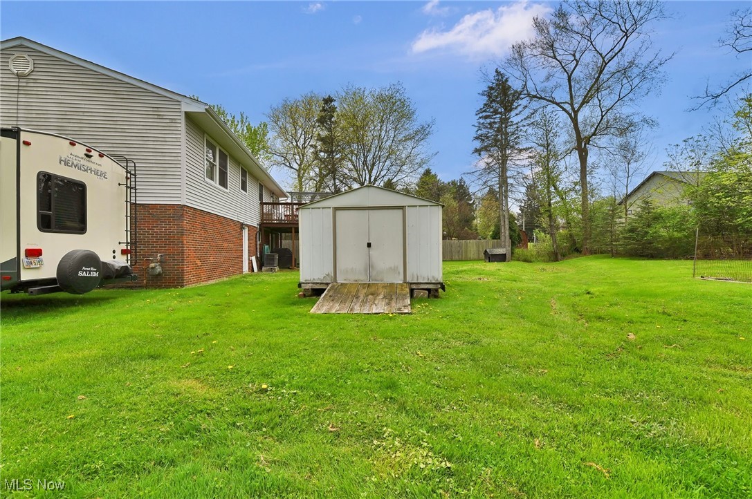 7676 Brecksville Road Independence, OH 44131 - Photo 26 of 32 View of yard featuring a storage shed and an outdoor structure