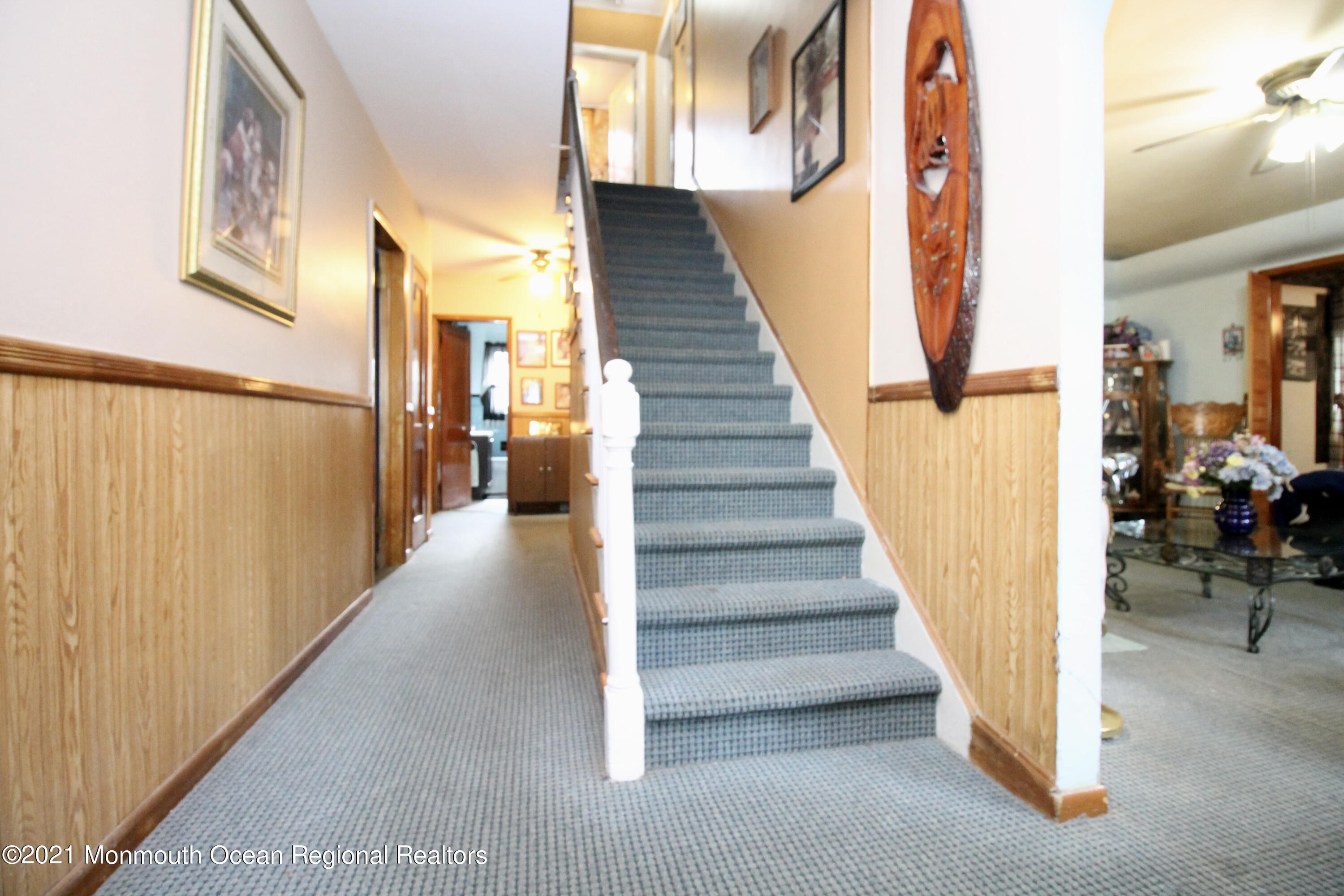 195 Bennett Road Freehold, NJ 07728 - Photo 12 of 90 a view of a hallway with wooden floor and staircase