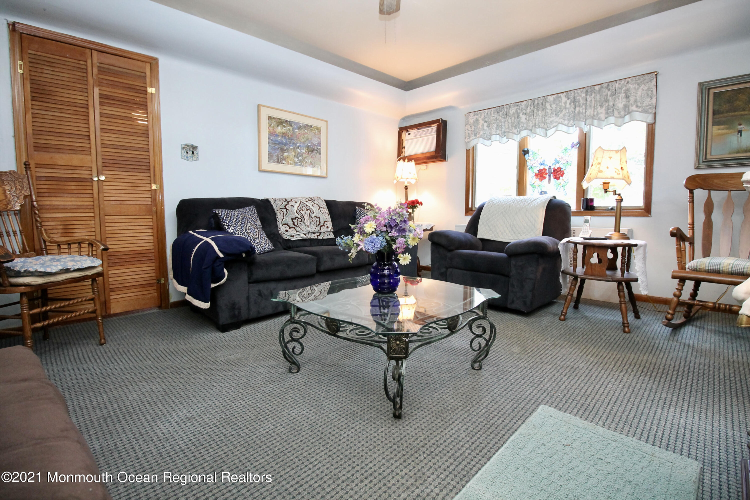 195 Bennett Road Freehold, NJ 07728 - Photo 15 of 90 a living room with furniture a rug potted plant and a large window