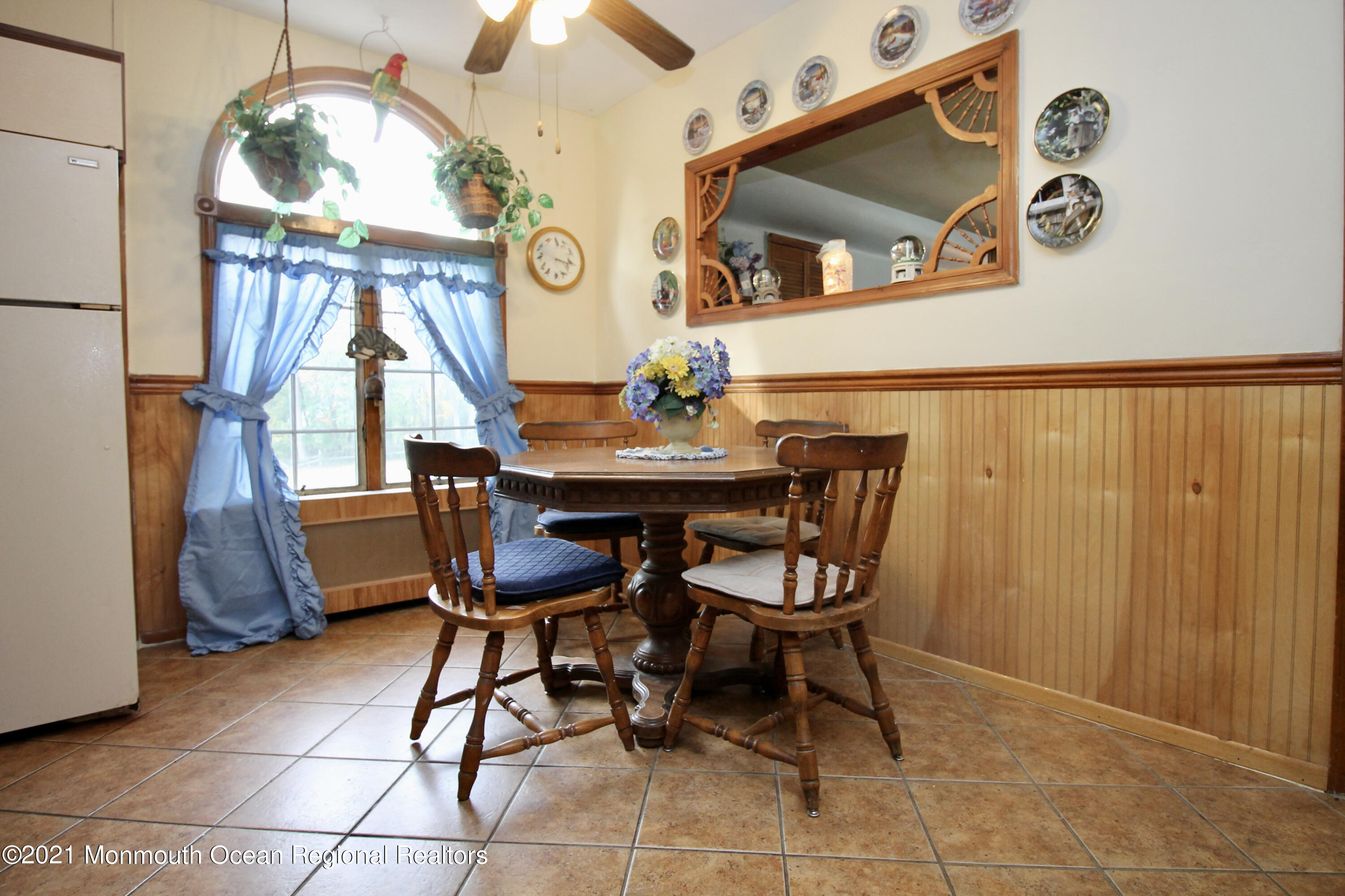 195 Bennett Road Freehold, NJ 07728 - Photo 17 of 90 a dining room with furniture and a chandelier