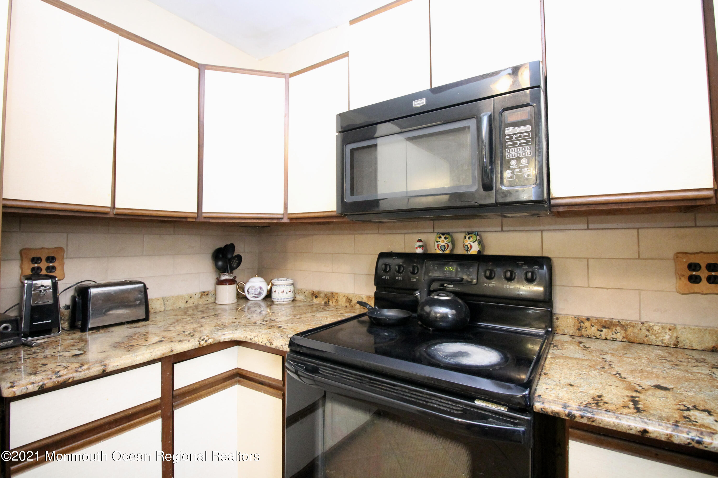 195 Bennett Road Freehold, NJ 07728 - Photo 21 of 90 a kitchen with stainless steel appliances granite countertop a stove a sink and cabinets