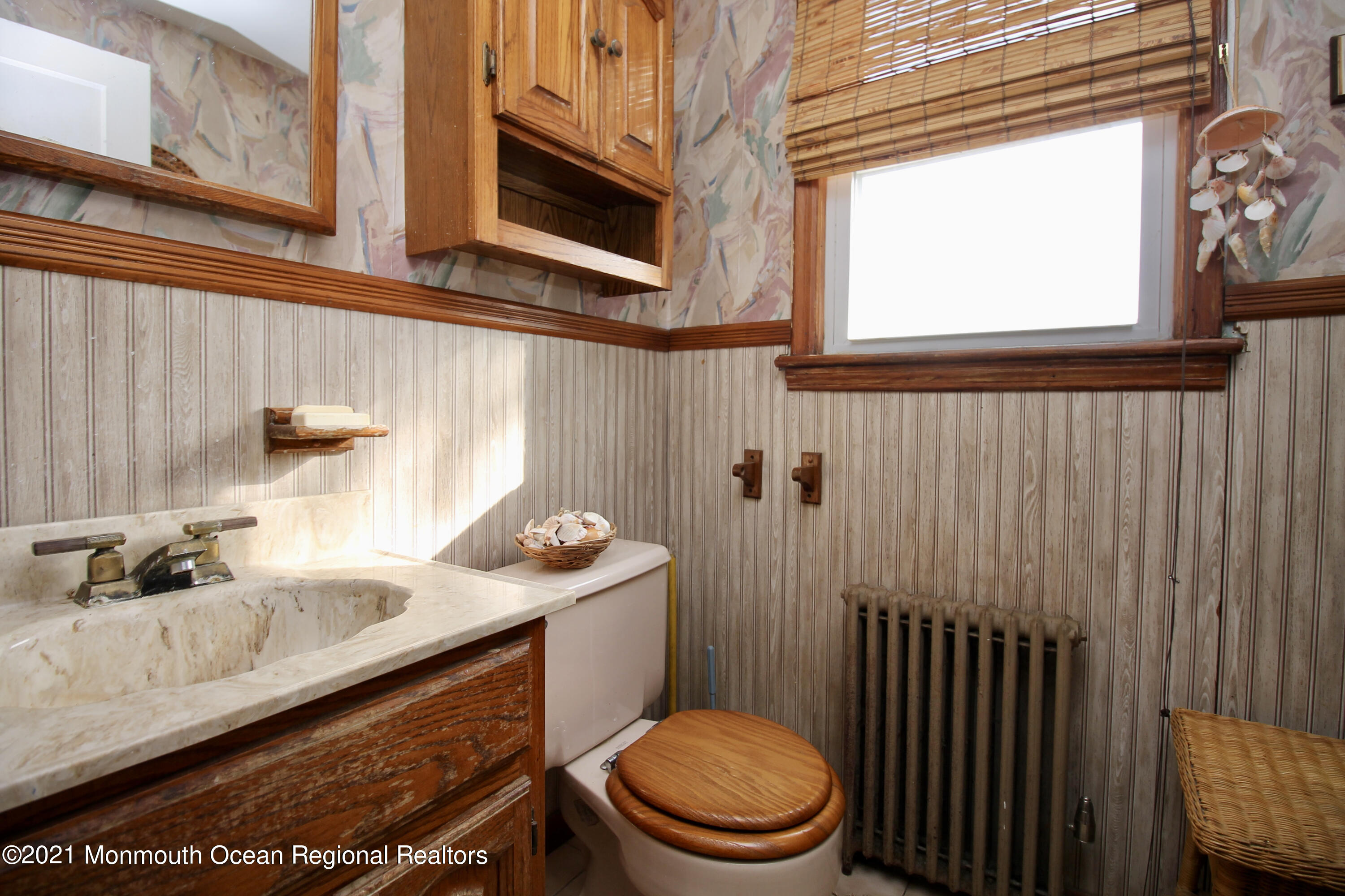 195 Bennett Road Freehold, NJ 07728 - Photo 37 of 90 a bathroom with a sink a toilet and shower curtain