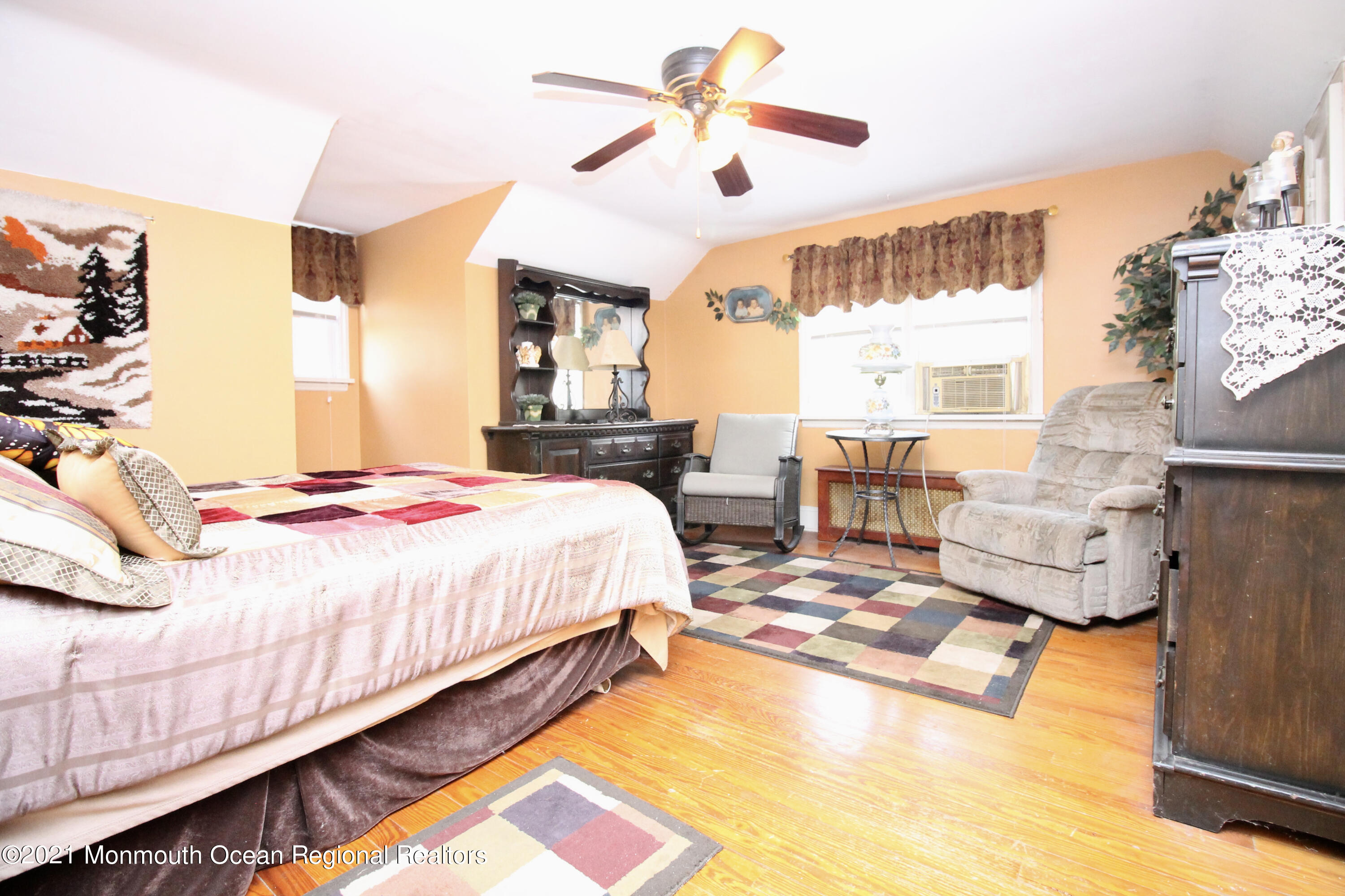195 Bennett Road Freehold, NJ 07728 - Photo 38 of 90 a bed room with a bed and a chandelier