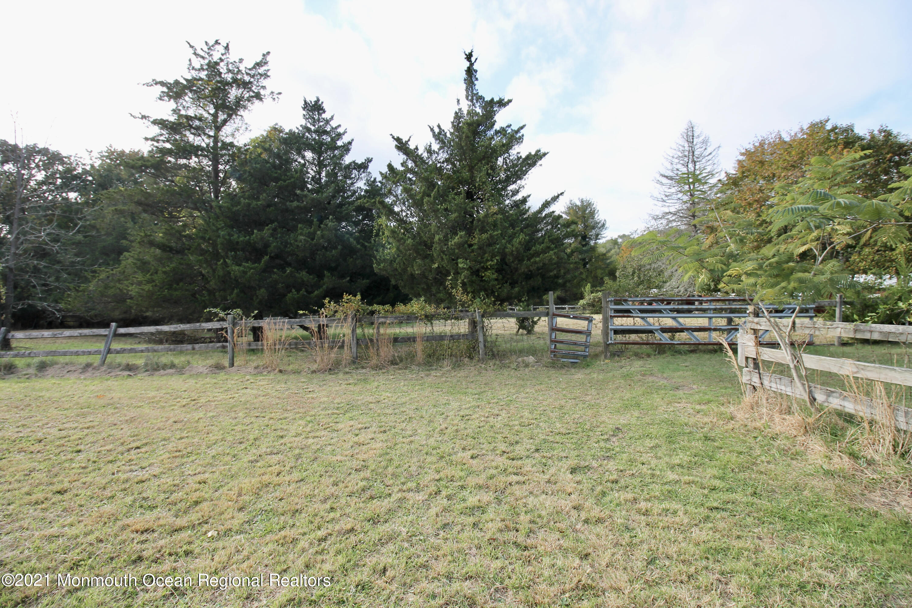 195 Bennett Road Freehold, NJ 07728 - Photo 54 of 90 a view of a swimming pool with a table and chairs