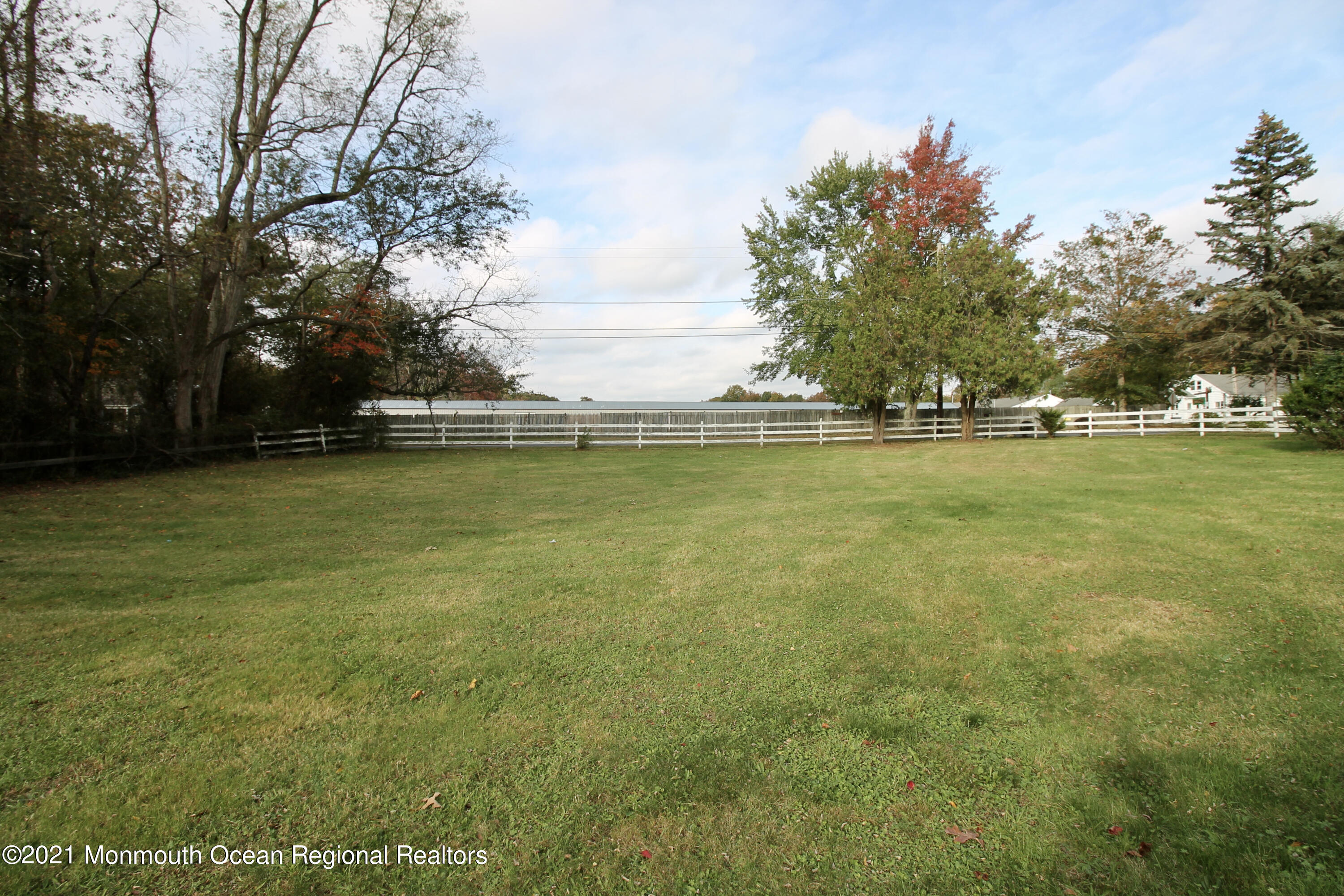 195 Bennett Road Freehold, NJ 07728 - Photo 64 of 90 a view of a swimming pool and trees in the background