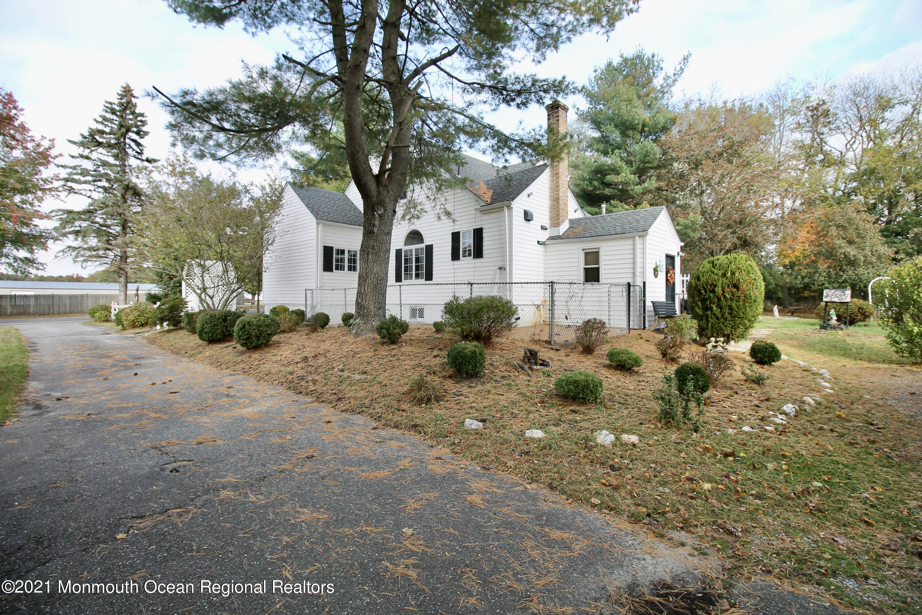 195 Bennett Road Freehold, NJ 07728 - Photo 67 of 90 a white house that has a tree in front of it